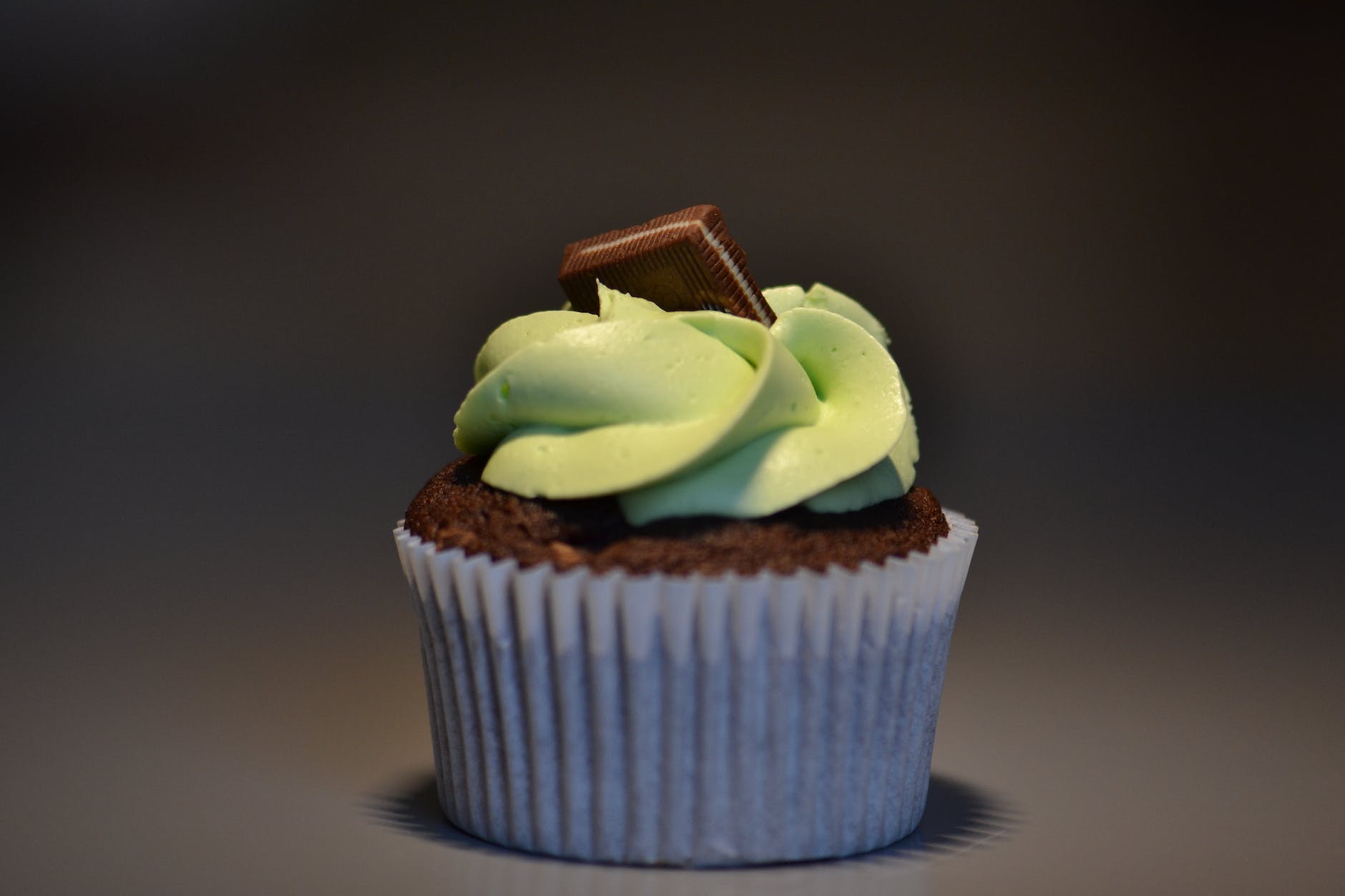 selective focus photography of chocolate cupcake